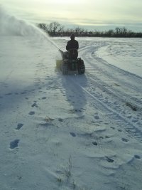 Alan using the snowblower on the driveway